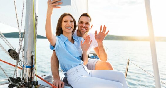 Couple On Yacht Making Selfie Enjoying Cruise At Seaside